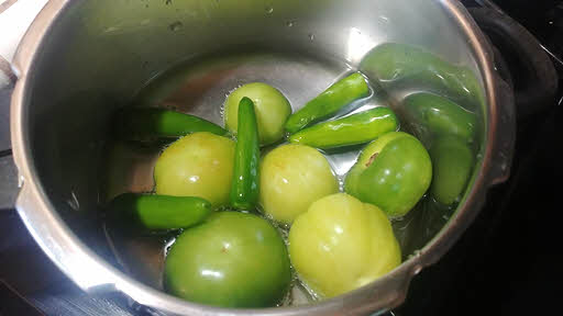 Boil tomatillos and peppers