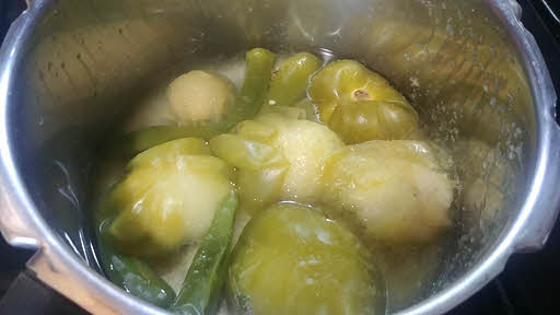 Boil tomatillos and peppers