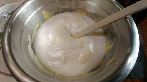 Fold in the egg white mixture in the flour mixture