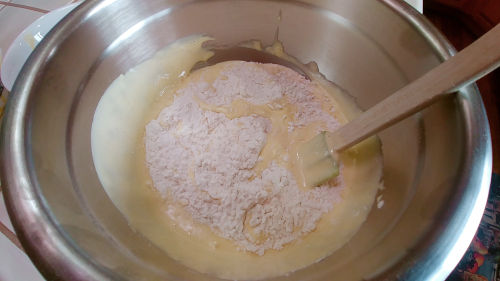 fold in the egg yolk mixture in the flour mixture