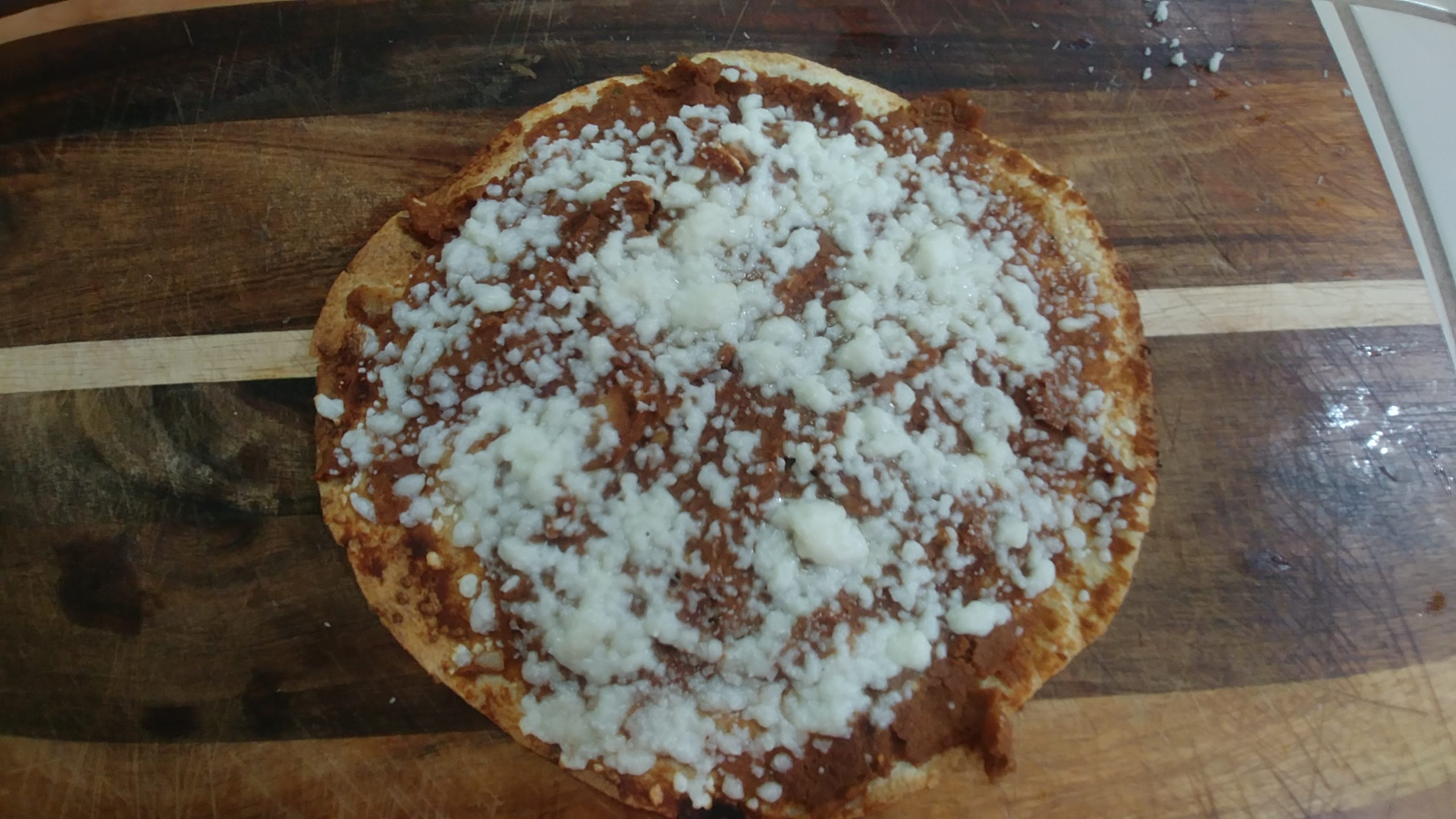 Tortilla with refried beans and cheese