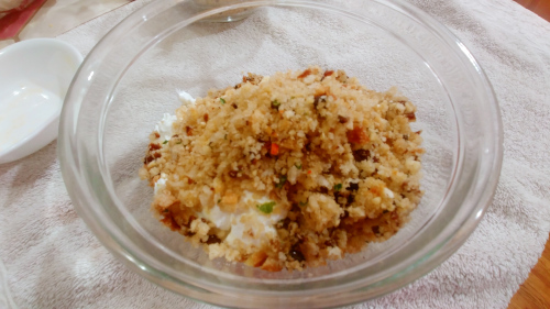 In a big bowl add hung curd, bread crumb mixture, salt and red chilies