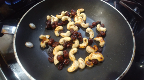 Saute cashews and raisins