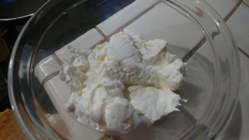 In a big bowl add hung curd, bread crumb mixture, salt and red chilies