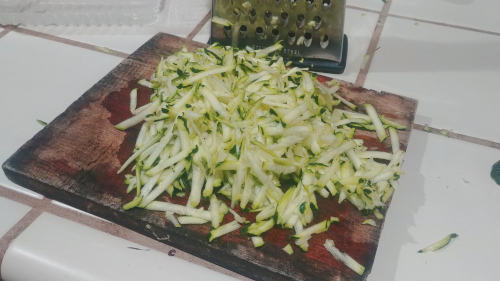 Grate zucchini coarsely