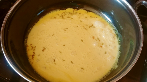 Pour the kadhi mixture into the saucepan