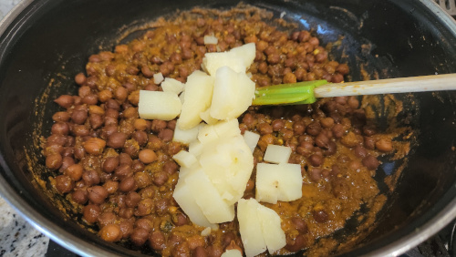 Saute onion ginger garlic for curried kale chane